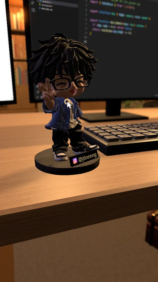 A small figurine with a name plate on the desk